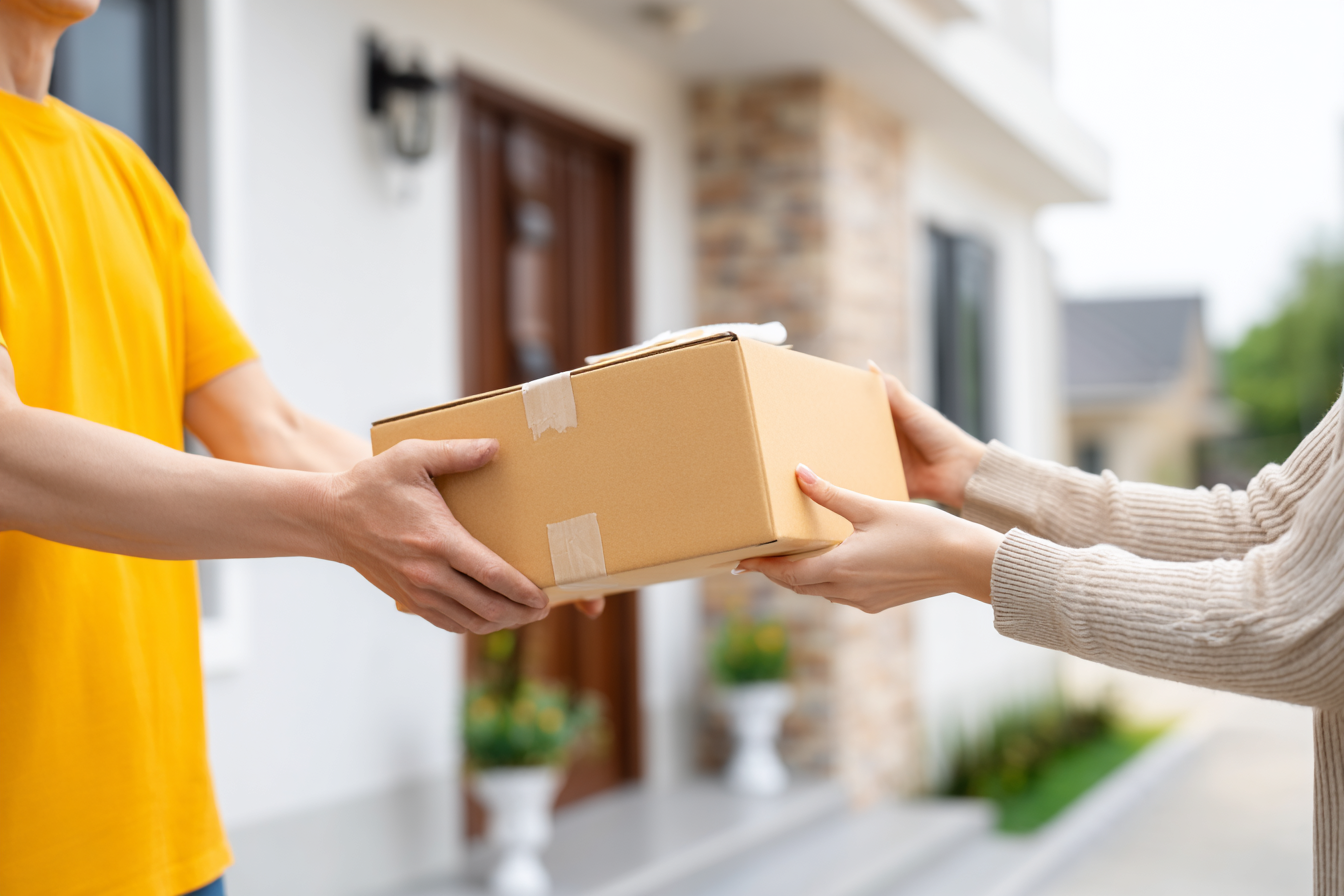 Photo of a satisfied customer receiving a package